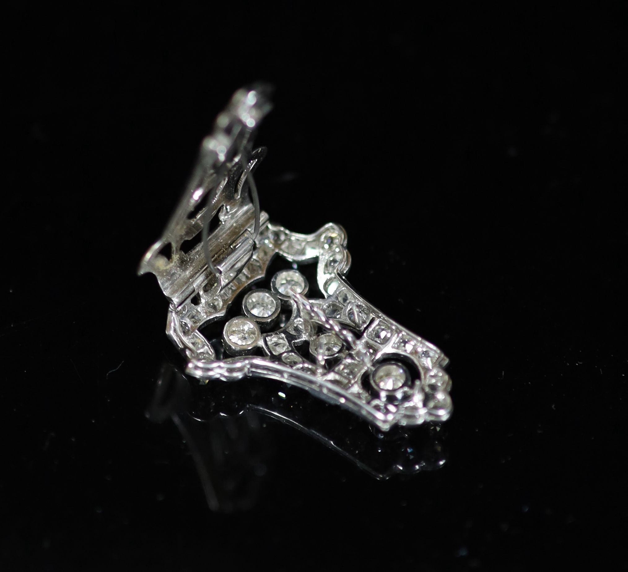 A 1920's/1930's Art Deco pierced platinum and diamond clip brooch